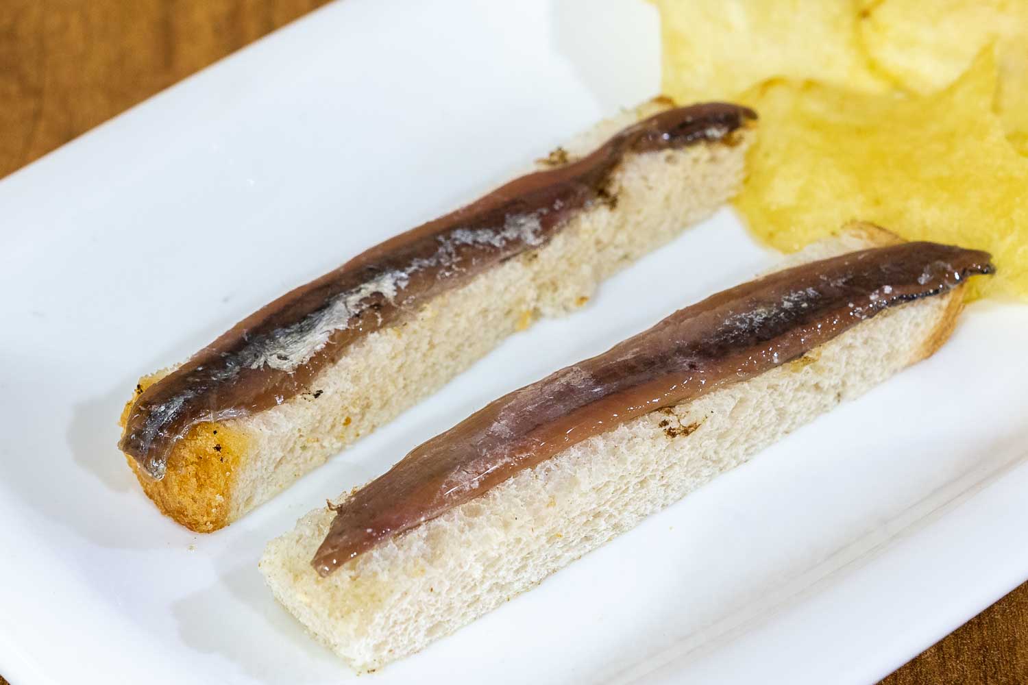 Strips of bread with cantabrian anchovies