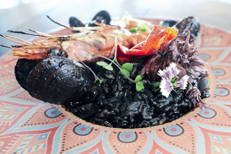 Black rice risotto with almadraba tuna, seaweed and king prawns