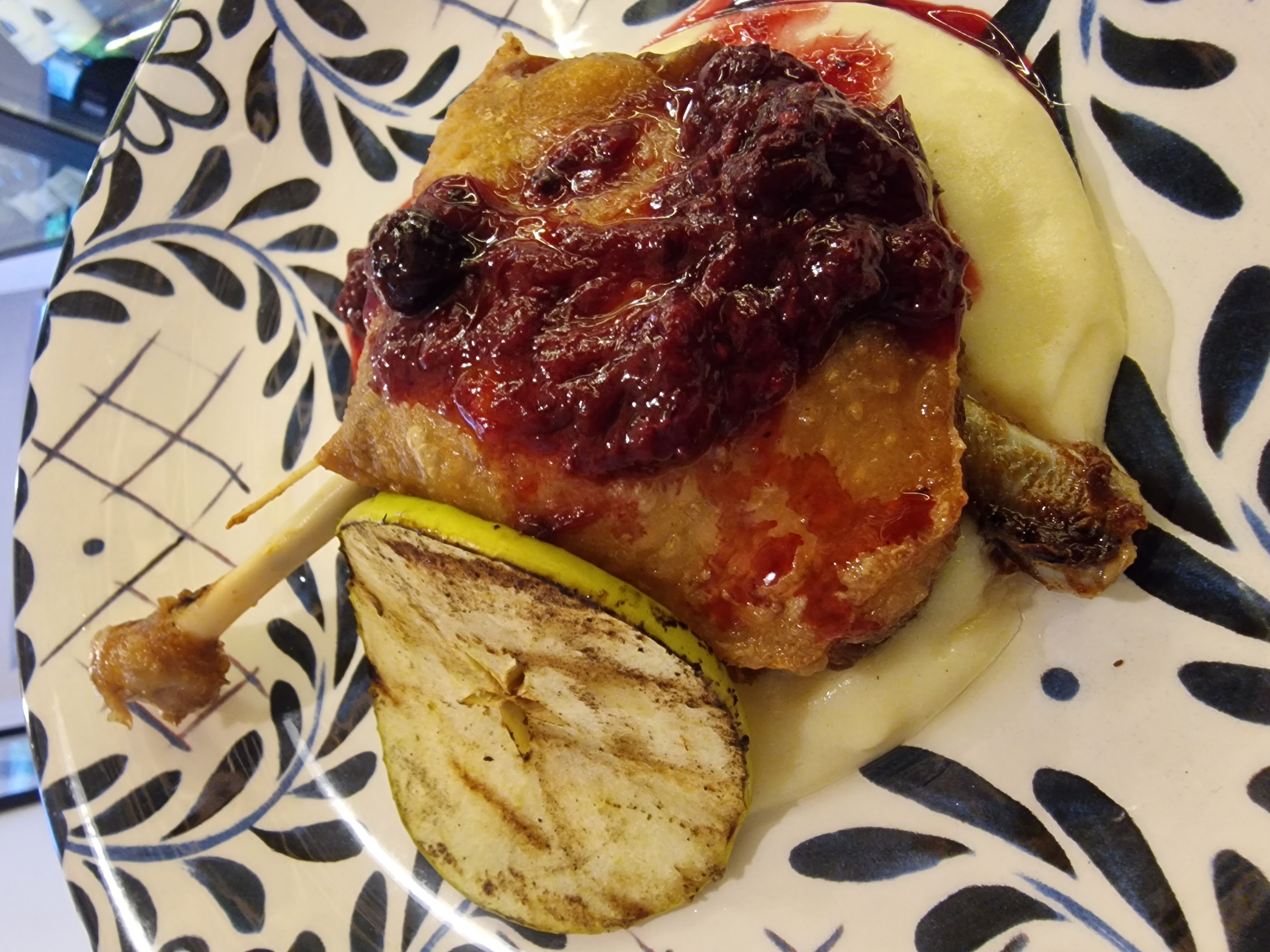Duck confit with red berries sauce and creamy puree