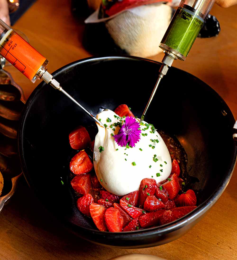 Fresh burrata injected with basil emulsion and Asian Mery. Accompanied by our pickled strawberries.