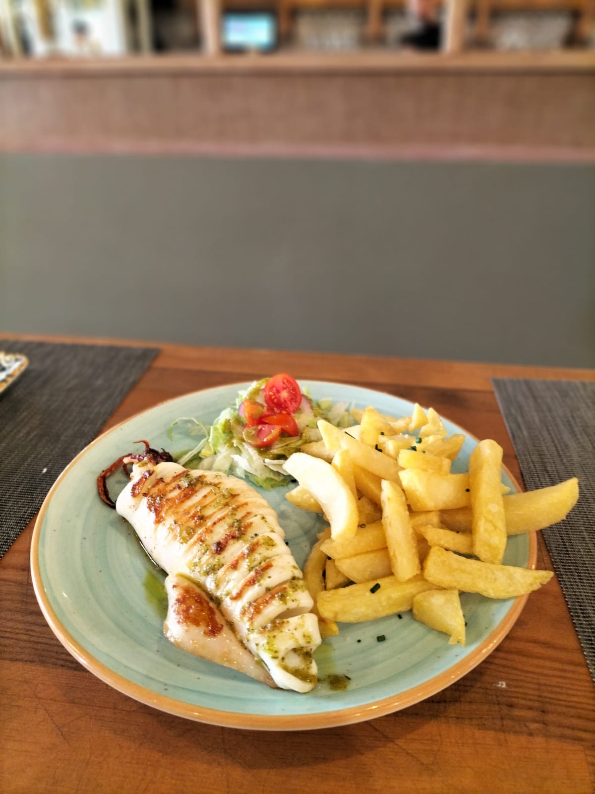 Grilled Squid with herb oil and French fries