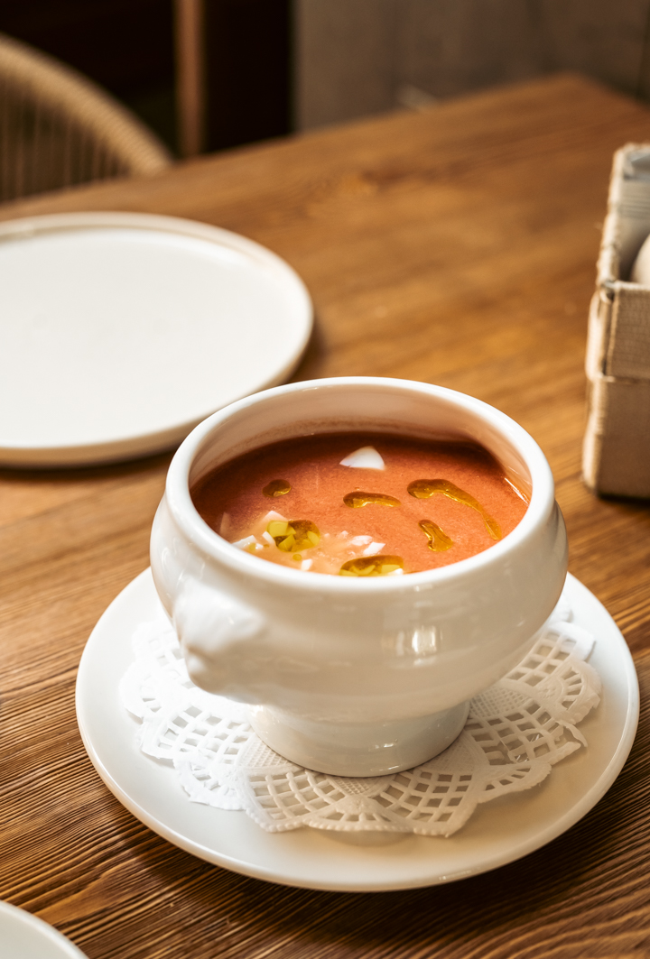 Bowl of gazpacho cream with oil and egg