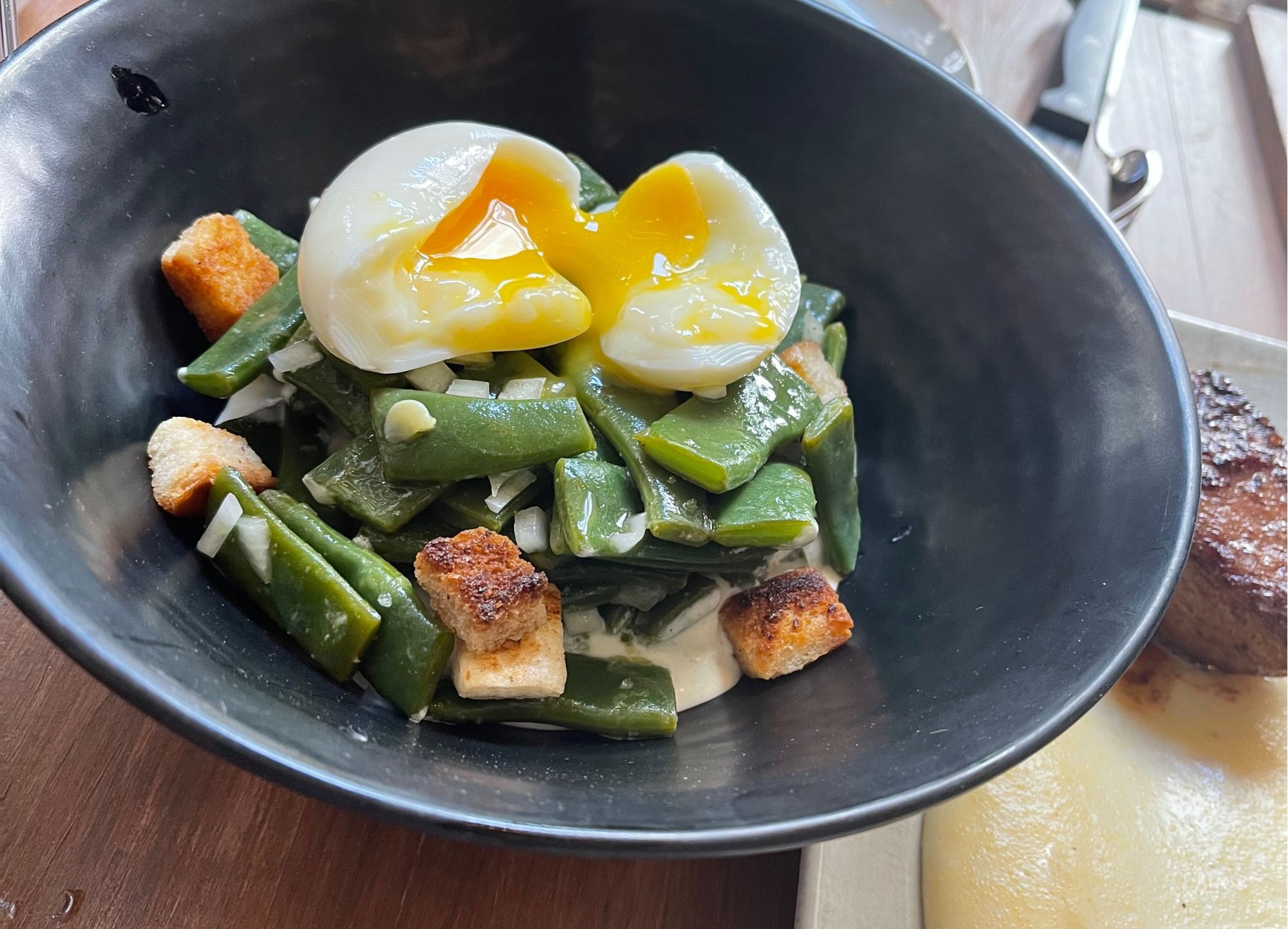 Green bean salad with sweet onion, egg and lemon vinaigrette with cottage cheese sauce