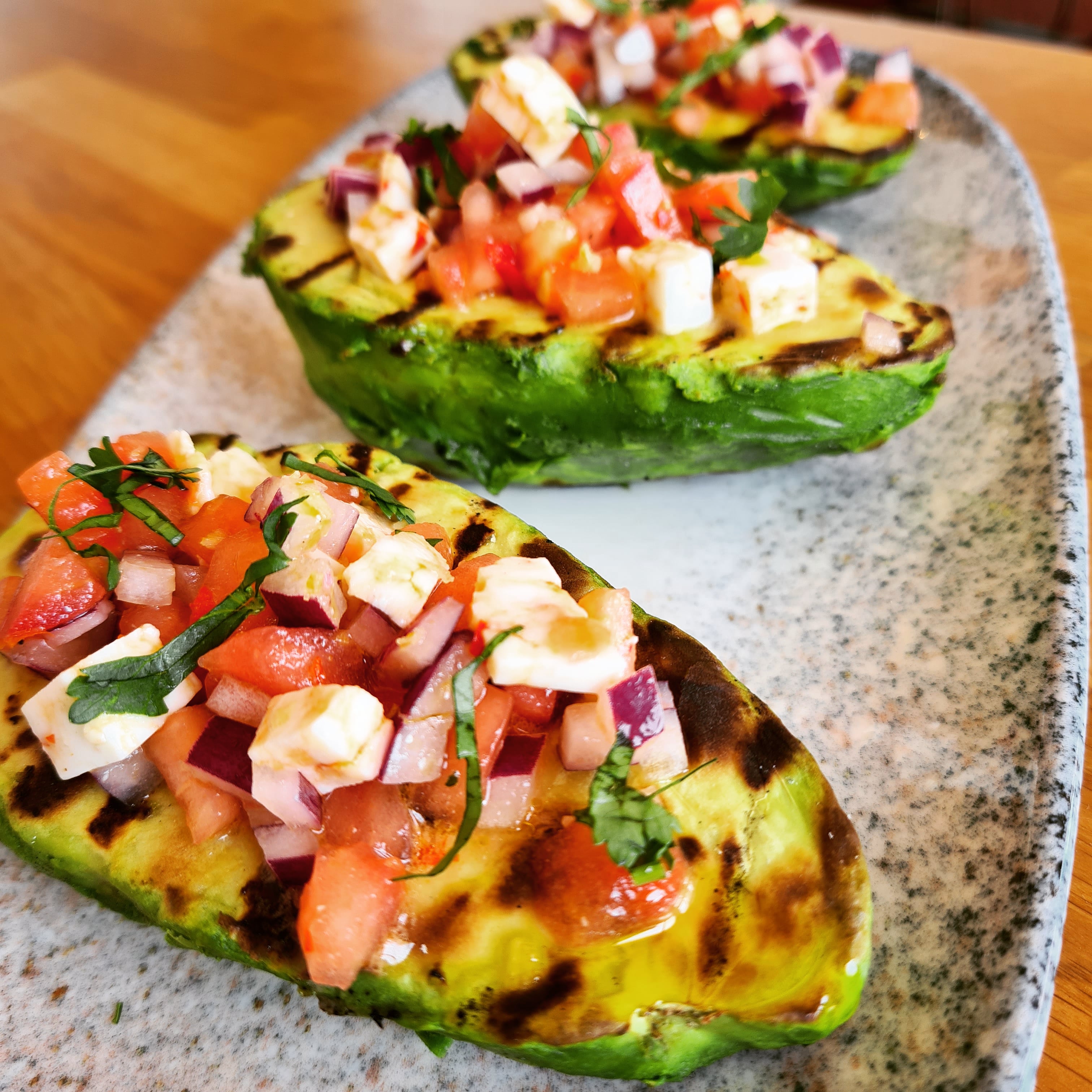 Grilled avocado with Payoyo cheese with chili pepper