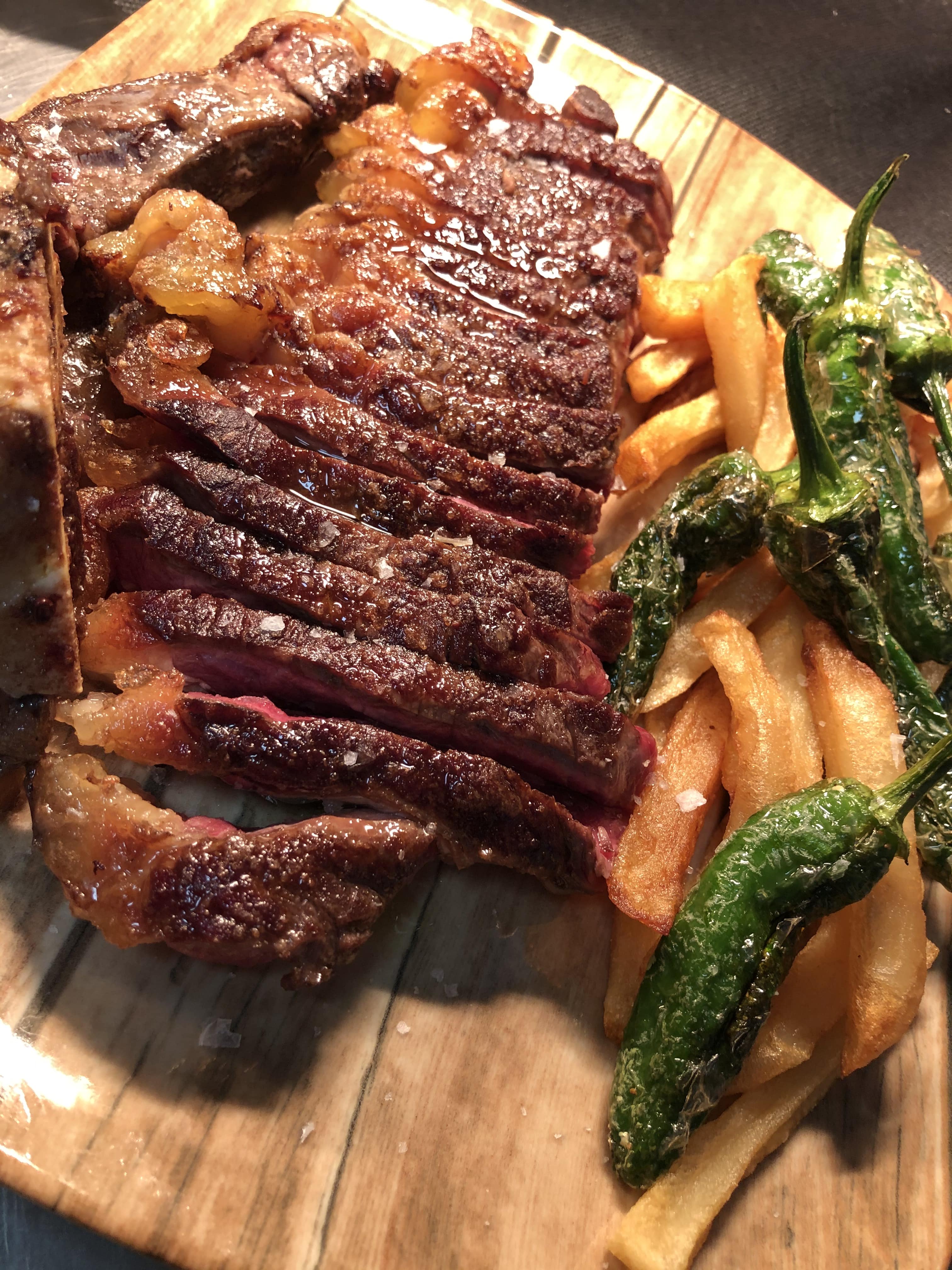 Matured steak "Txogitxu" with traditional potatoes and padrón peppers