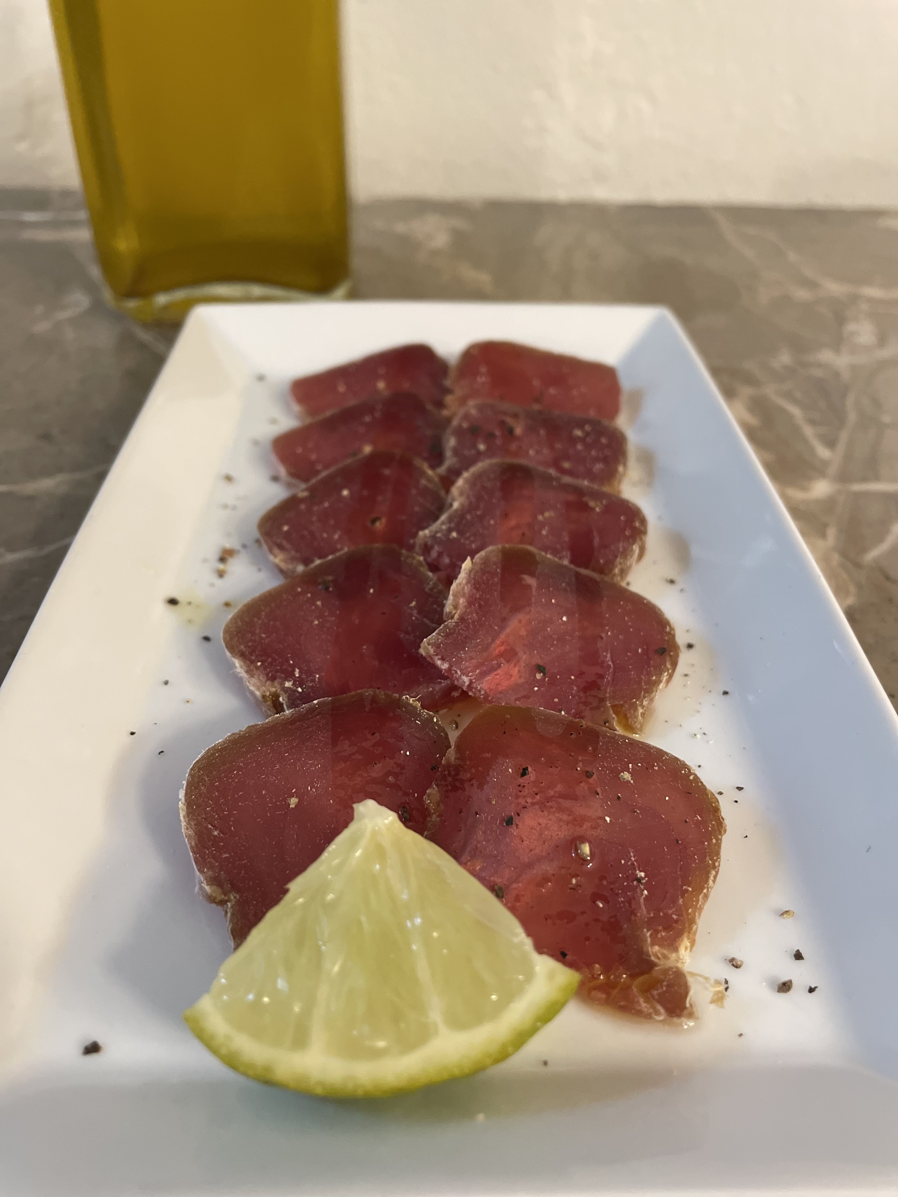 Tuna mojama with extra virgin olive oil, lime and pepper