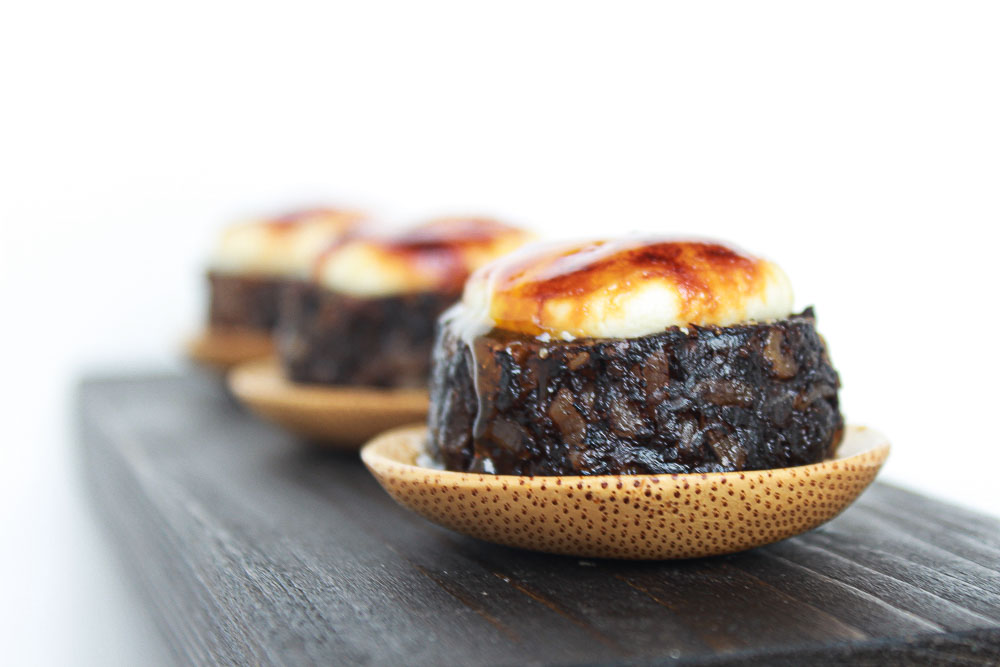 Black pudding with caramelized goat cheese and tangerine emulsion