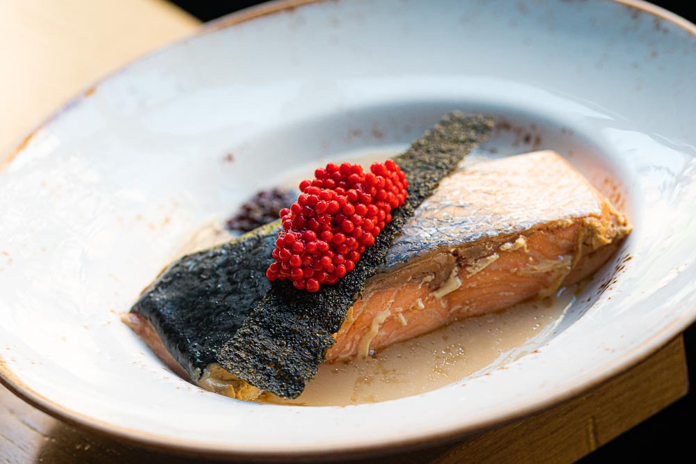 Salmon in rice cream, caviar soy, fried nori seeweed, tobiko roe.