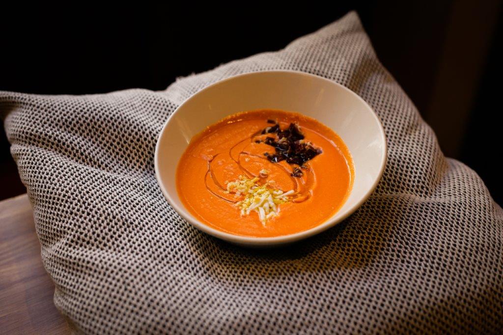 Salmorejo (creamy gazpacho) garnished with egg, ham and olive oil