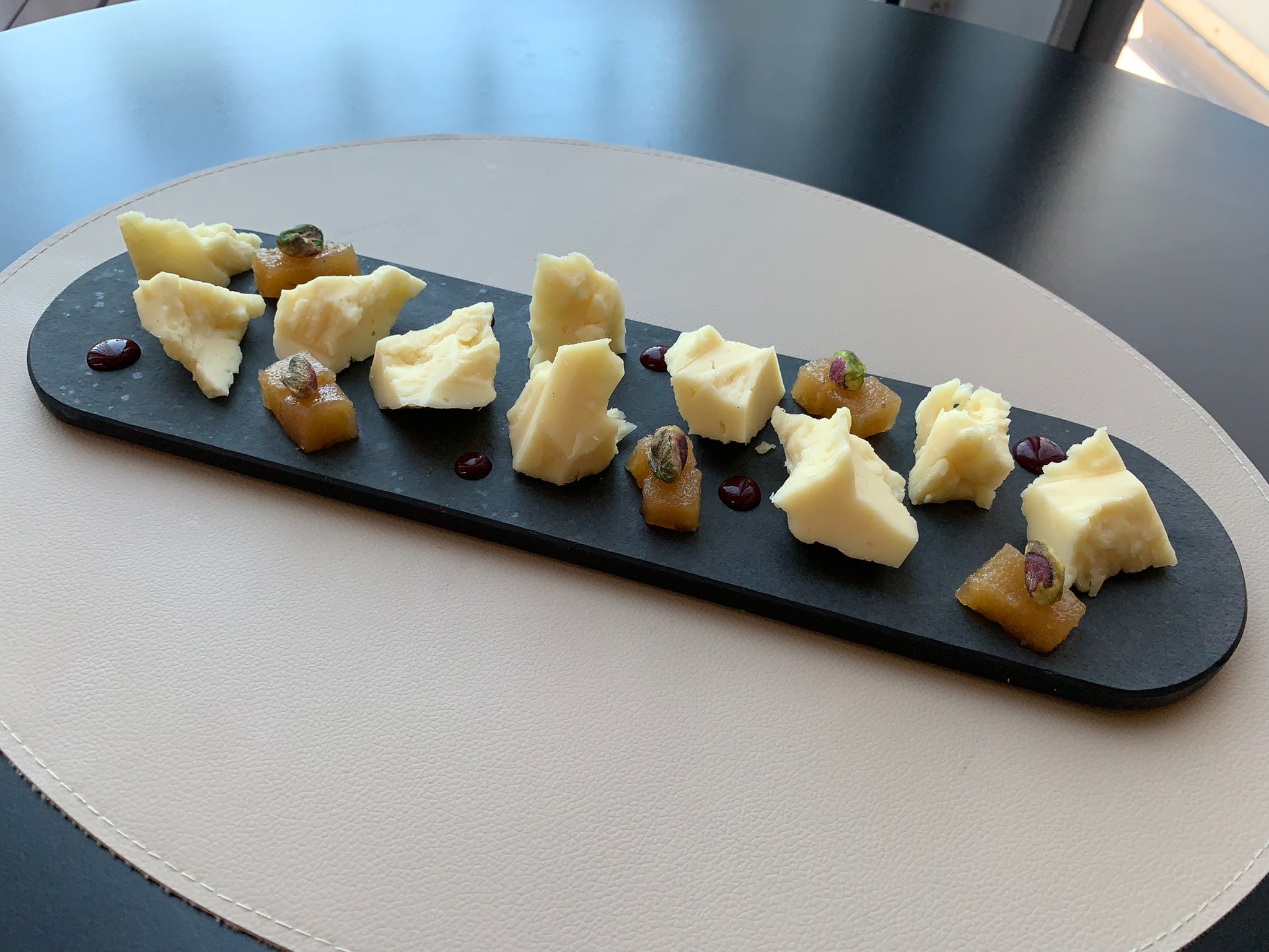 Chunks of cheese with quince and raspberry jam