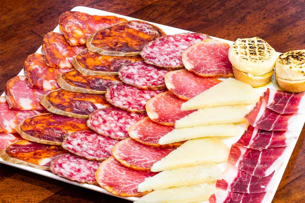 Assorted platter of local cured meats and aged cheeses