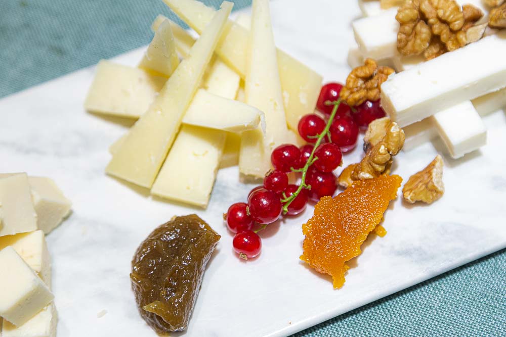 Cheese board with jam and nuts